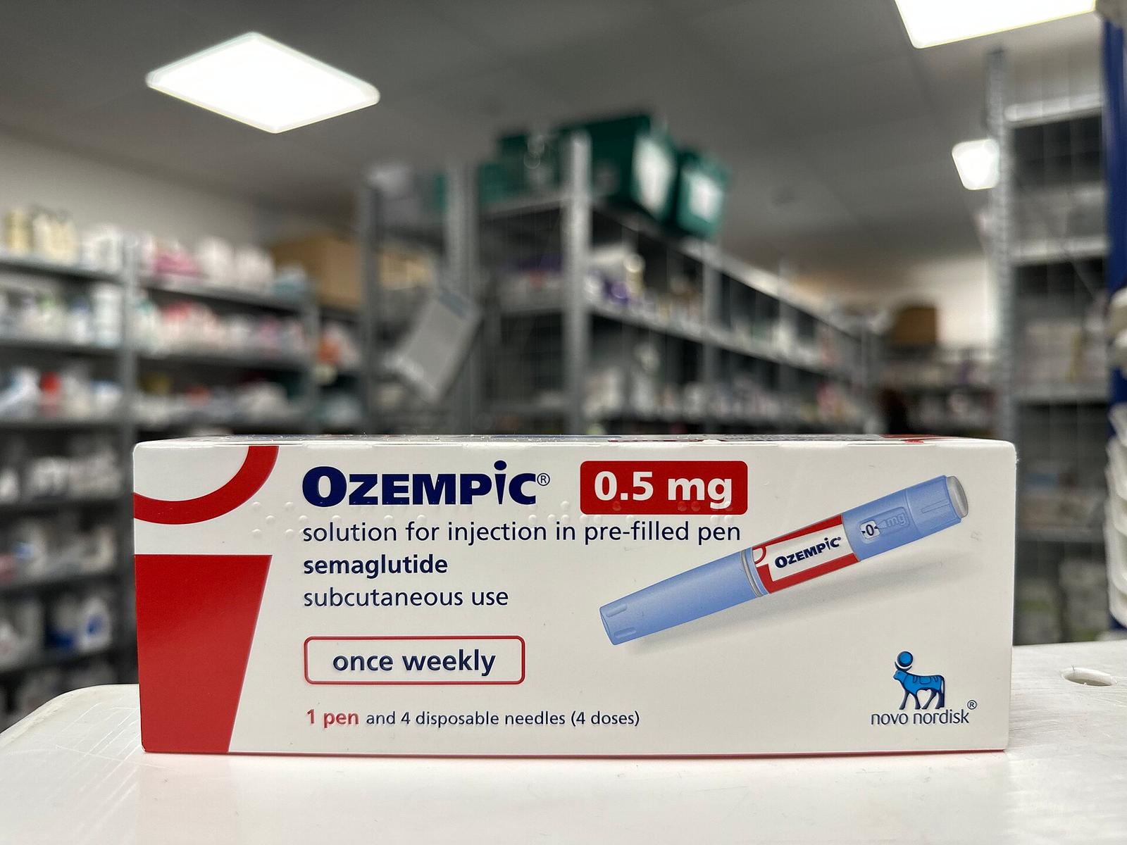 A boxed once-weekly semaglutide pen on a pharmacy counter
